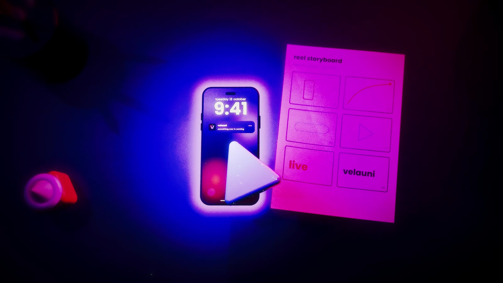 a phone wakes on a dark desk next to a storyboard