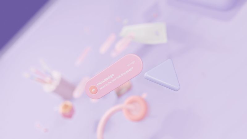 defocused desk with a 3d cursor and pink shapes